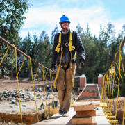 Jay Arehart crosses a footbridge under construction by Bridges to Prosperity.  