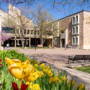 CU Engineering Center with tulips in front of it