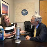 Behind-the-scenes photo of the podcast recording with van Den Heever and Holdren. 