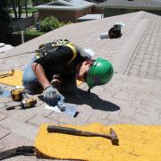 Student installing solar panel