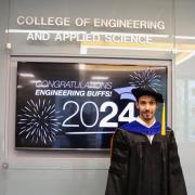 Osamah Dehwah in graduation regalia in front of a "Congratulations Engineering Buffs " digital screen.