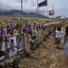Abbie Liel and Susan Osterman walk next to a memorial for the Maui fire.
