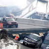 A collapsed bridge with cars falling