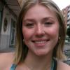 Breeze Kelly wearing a sleeveless top and necklace on a street in Valencia.