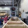 Researcher oversees the lowering of a pipe in the CIEST lab