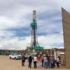 People at oil derrick site