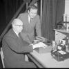 Helms in CU Boulder's photometric lab with an identified person in 1967.