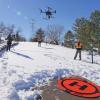 Members of the GEER team watch a drone take off from the Spanish Hills neighborhood.