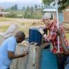 Children getting water from a Virridy thermos in Africa.