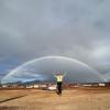 Kate MacKeigan under a full rainbow in Hawaii