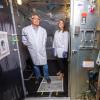 Professor Mark Hernandez and doctoral graduate Marina Nieto-Caballero stand inside a bioaerosol chamber in the Environmental Engineering disinfection laboratory at the Sustainability, Energy and Environment Complex (SEEC)