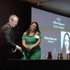 Briana Santa Ana receives her award from Dean Keith Molenaar.
