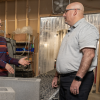 Mija Hubler discusses a project with Director of Project Management Leo Atencio.