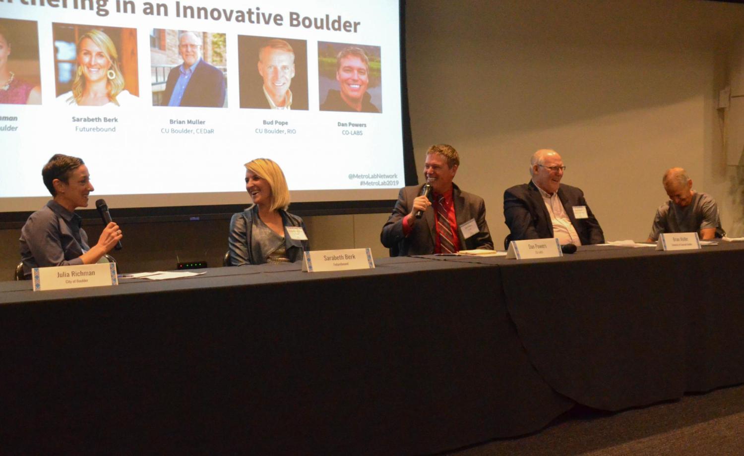The panel reacts during a funny moment in the Partnering in an Innovative Boulder