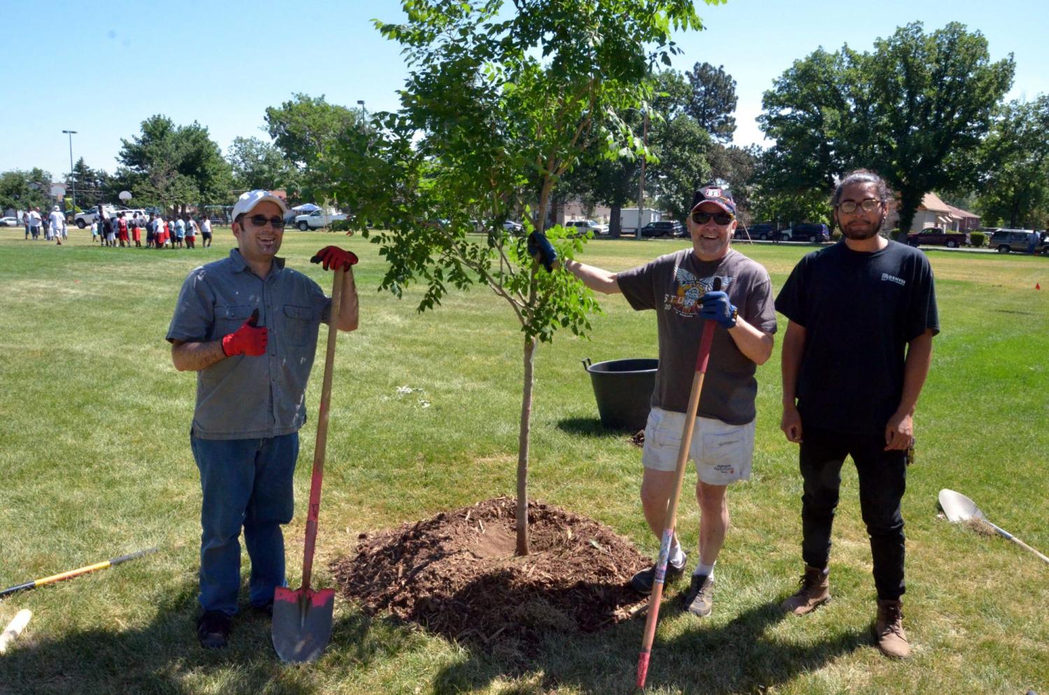 Community members planting trees and a butterfly garden in Dunham Park (Elyria-Swansea) in June 2018.