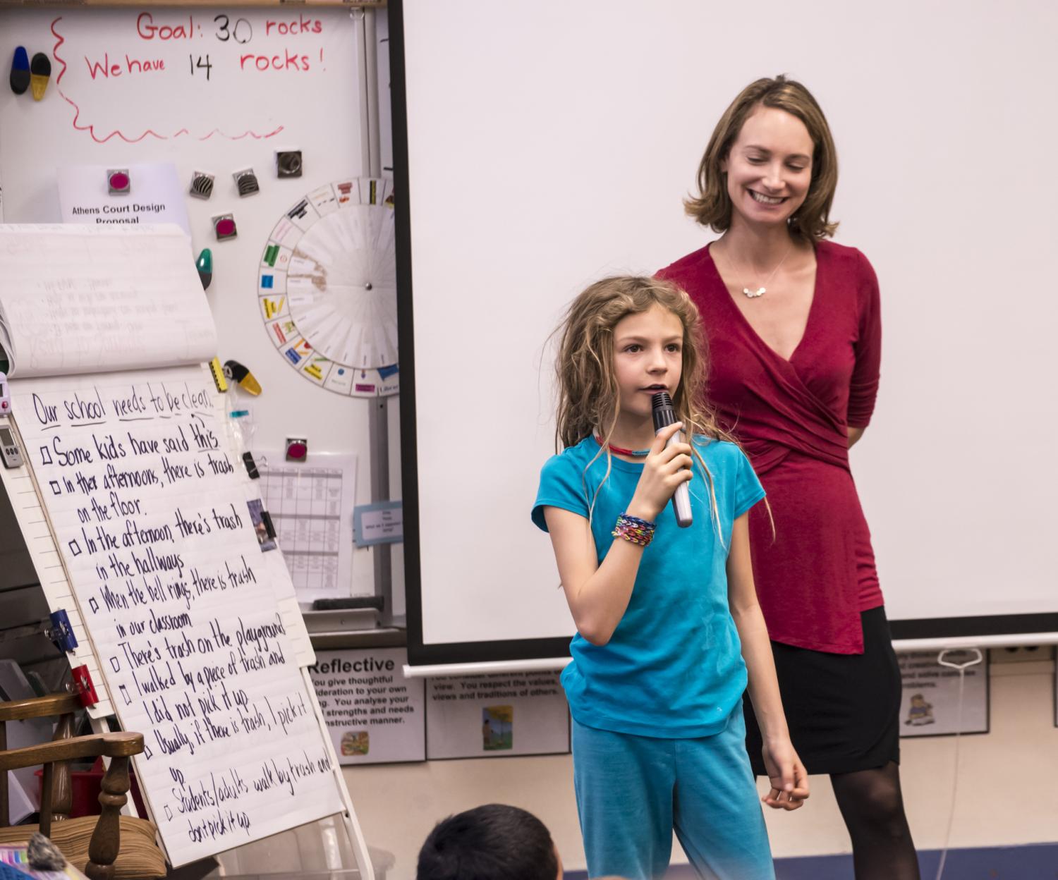 GUB Director Mara Mintzer listens to third grader share her ideas.