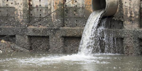 Stormwater pouring out of a pipe