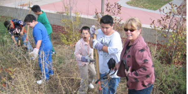 Students help maintain the native landscaping around their school