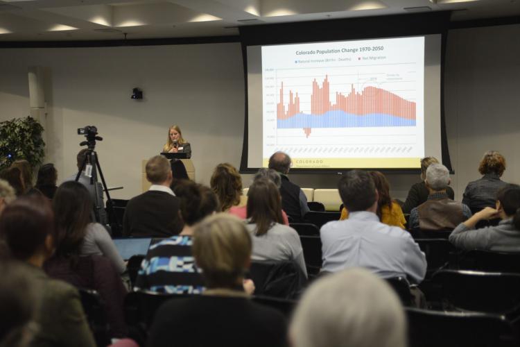 Shot from the back during a talk at the Squeezed Out Conference