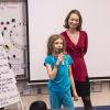 GUB Director Mara Mintzer listens to third grader share her ideas.