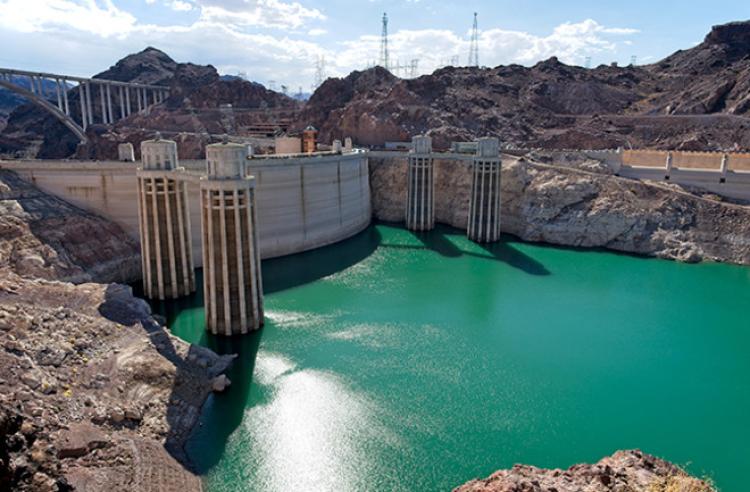 Hoover Dam holds back the waters of Lake Mead, the largest U.S. reservoir, as seen on June 28, 2022. At full capacity, the water reached almost to the top of the dam. Since then, it has dropped nearly 180 feet. To get a sense of scale, consider that this is more than 80 percent of the distance between the road bed of the Golden Gate Bridge and the water below. Credit: © Tom Yulsman.