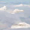 After Longyearbyen, the Arctic Lenses team flew to the research station of Ny-Älesund. Snow-draped mountains peeked up above the clouds as the small twin-engine plane descended toward the runway.
