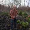 Michael Kodas (left) interviews an Indonesian environmental activist during one of his reporting trips to Sumatra and Borneo in 2014.