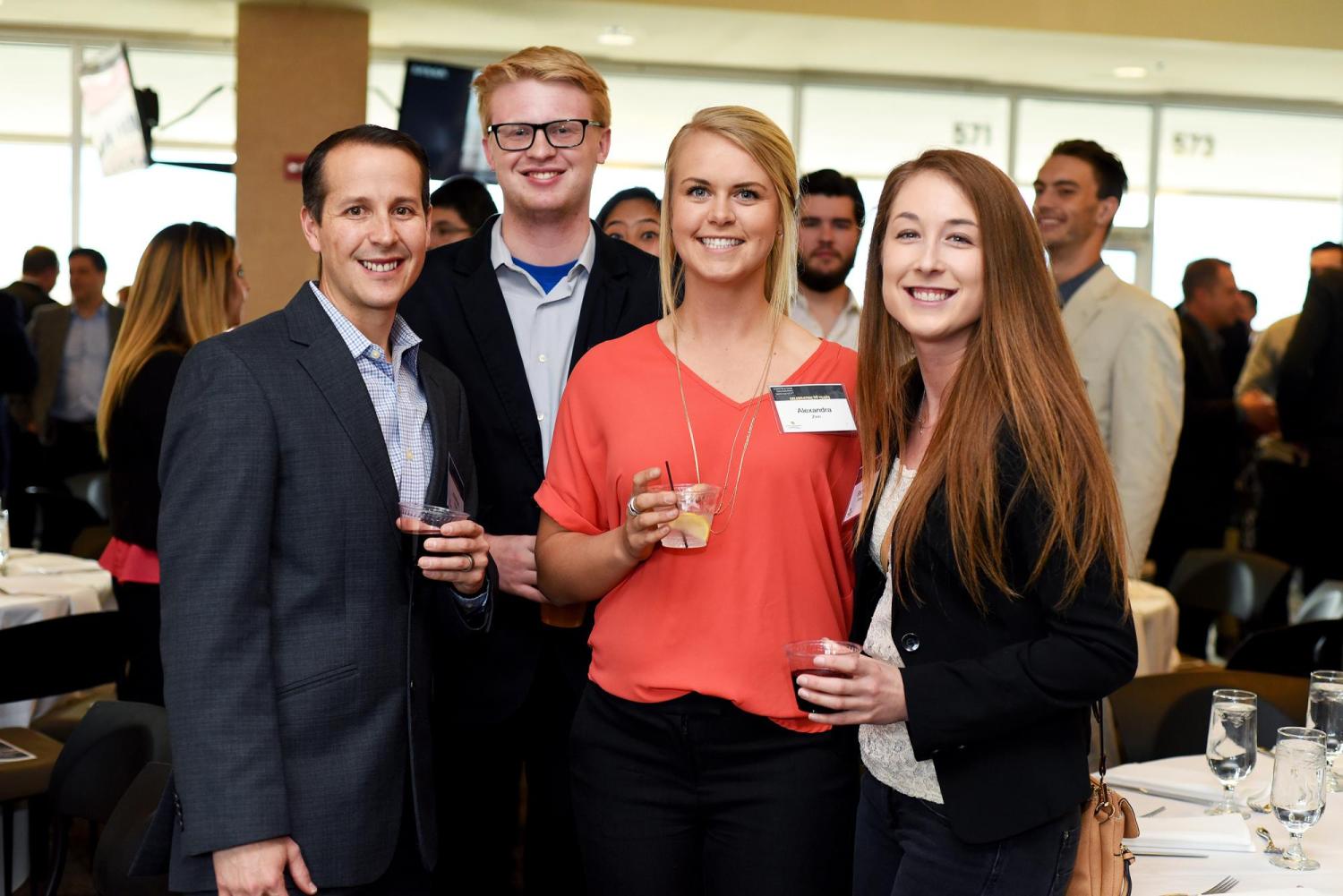 Four people at the CEM Anniversary Event
