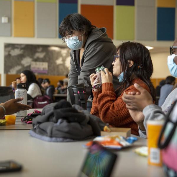 Ash Galaviz hangs with their friends during lunch at DSST: Green Valley Ranch High School. March 22, 2022.