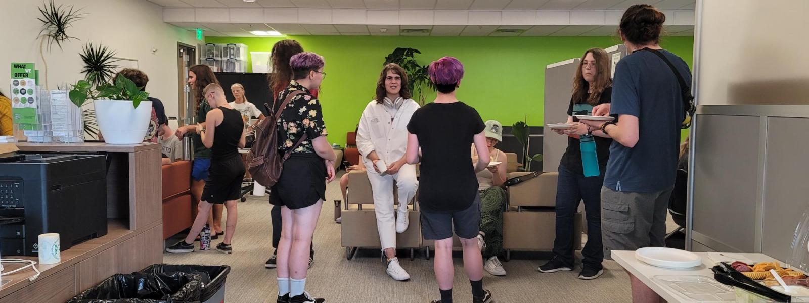 Students and instructors gather for snacks and drinks at the new HIVE