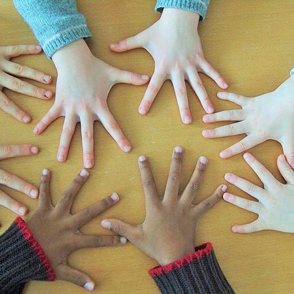 hands laid flat in a circle