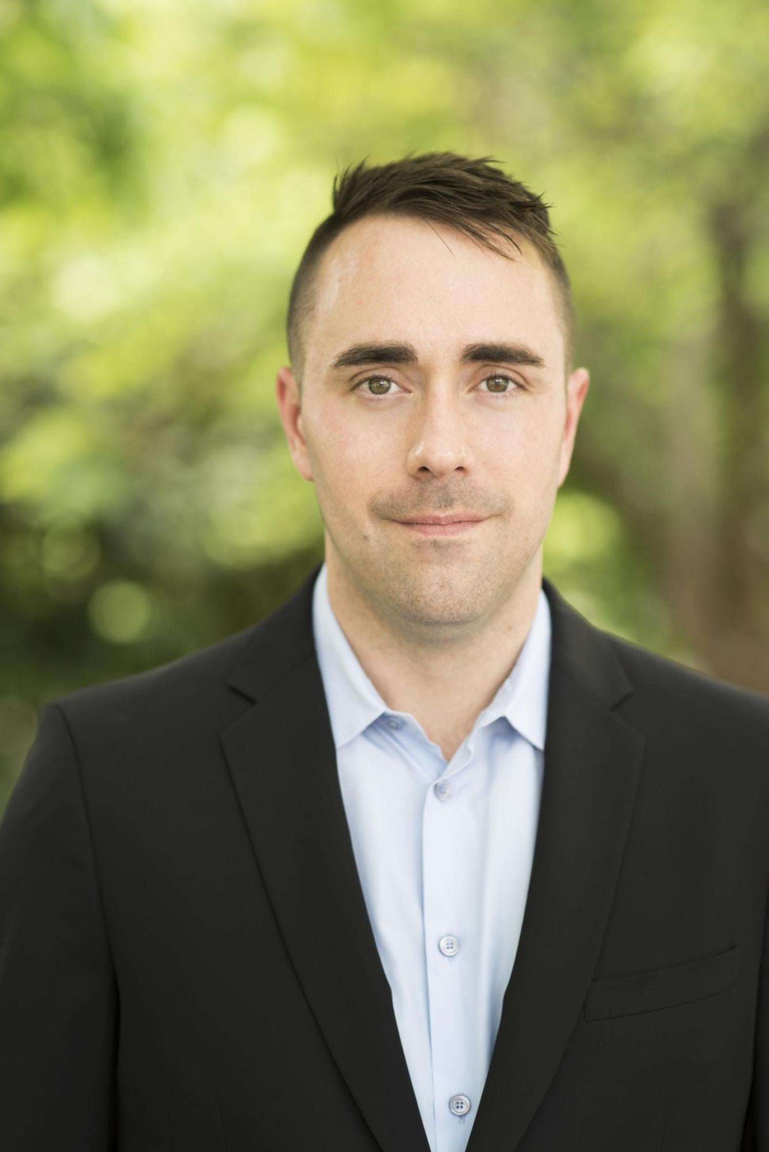 Headshot of Eric Alston