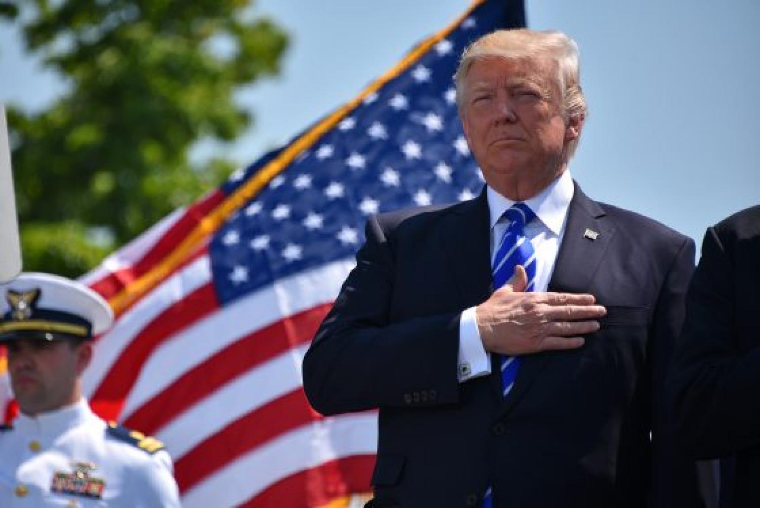 President Trump salutes the flag.