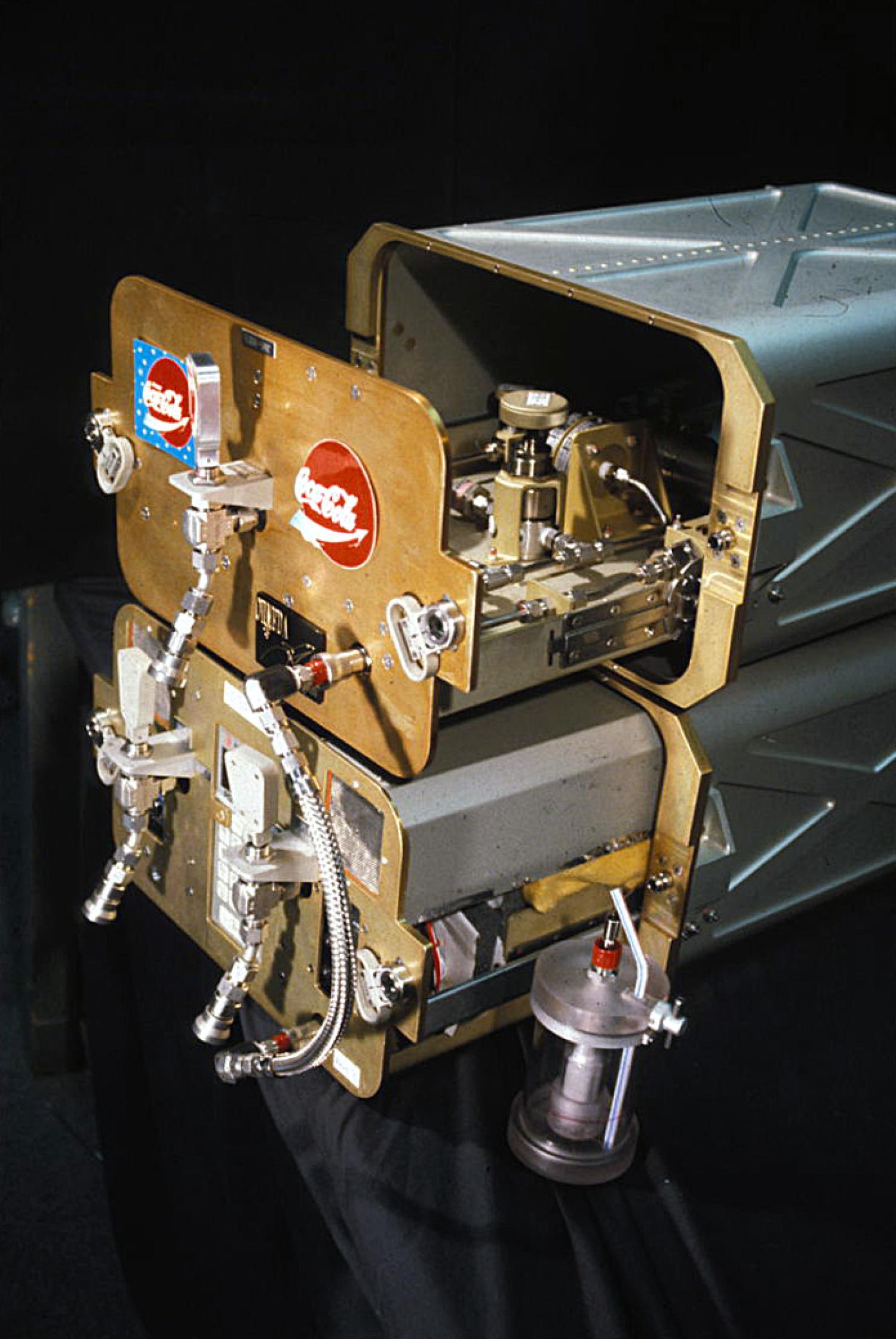 FGBA-2 partially removed from its lockers, revealing the fluid processing hardware within