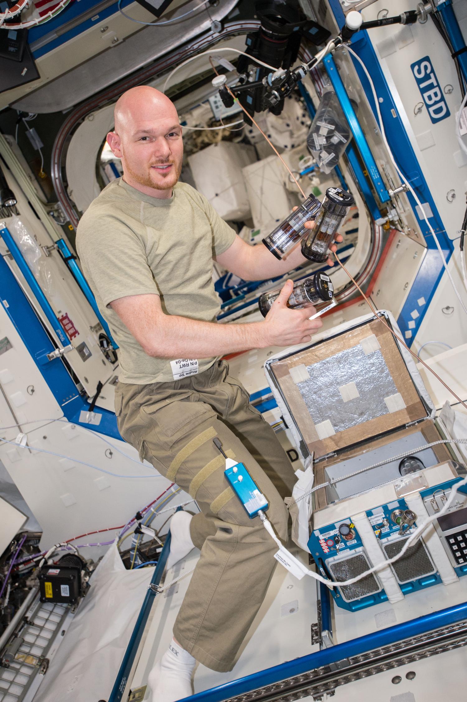 ESA astronaut Alexander Gerst juggling GAPs pulled out from CGBA on ISS