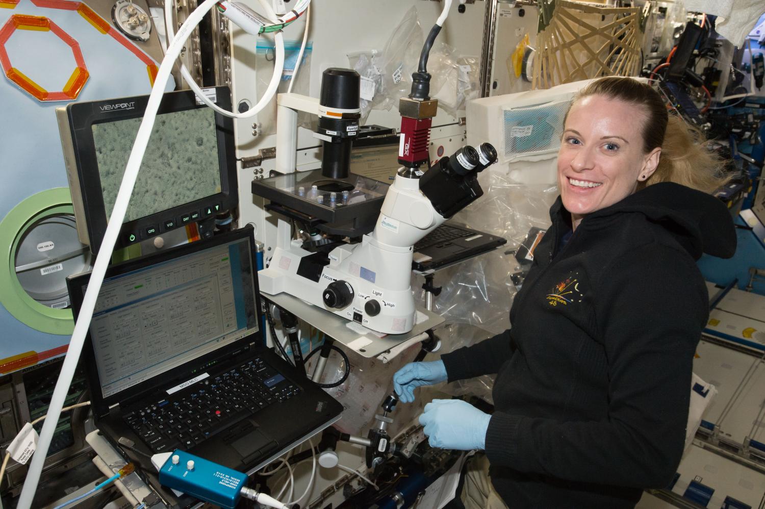Astronaut Kate Rubins using the BioServe Microscope on ISS