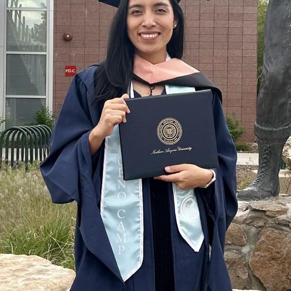 Image of Cande in a Graduation Gown