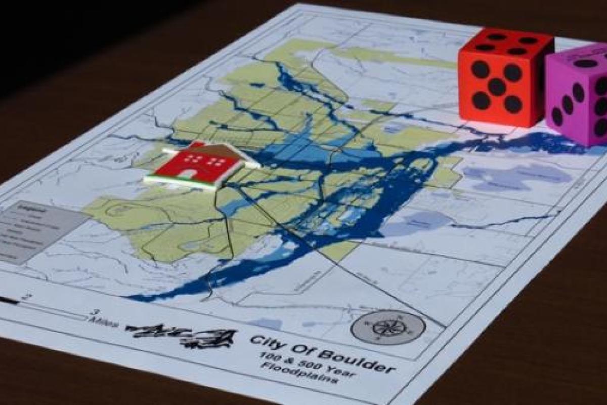 pair of dice on top of a map of boulder