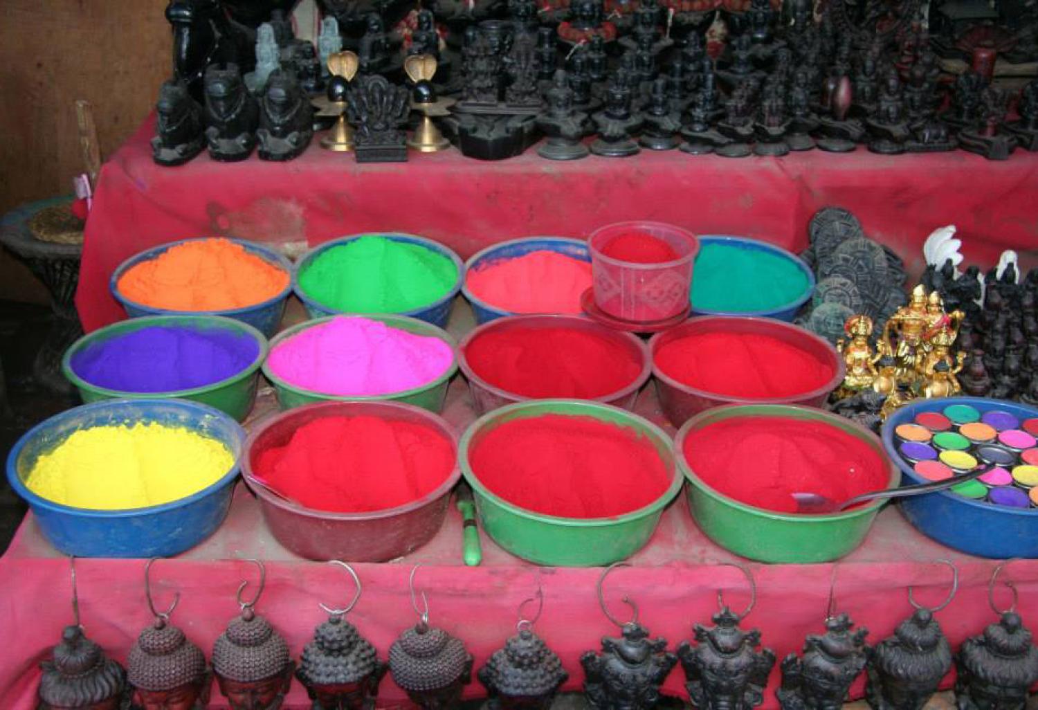 Bowls of multi-colored Holi powder.