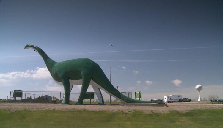 Large sculpture of a dinosaur.