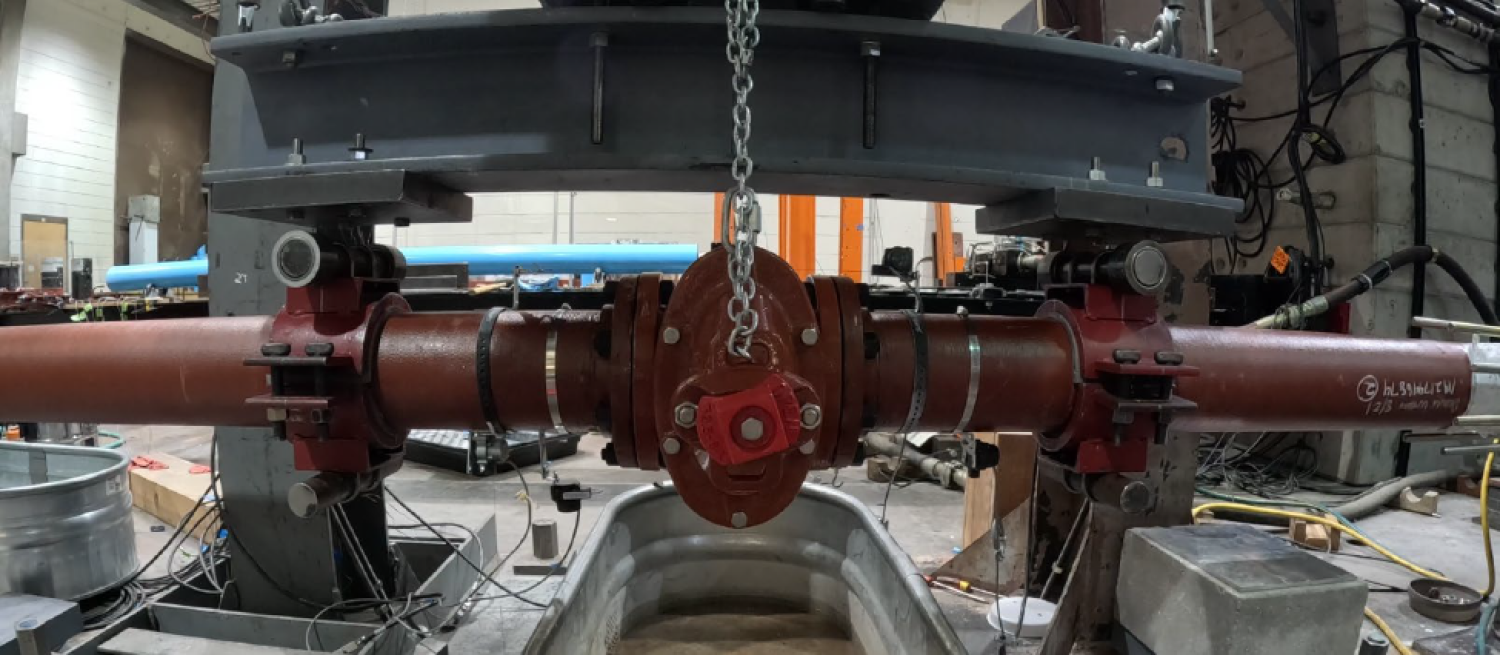 Pipe specimen in bi-axial test frame