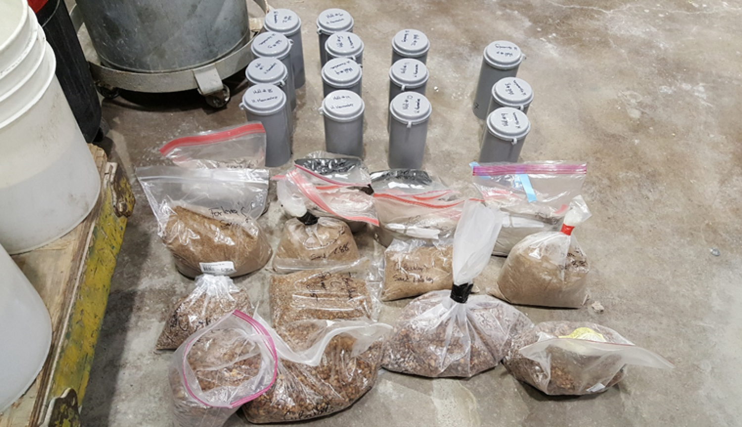 Materials previously weighed in the laboratory and ready for the elaboration of four concrete formulations