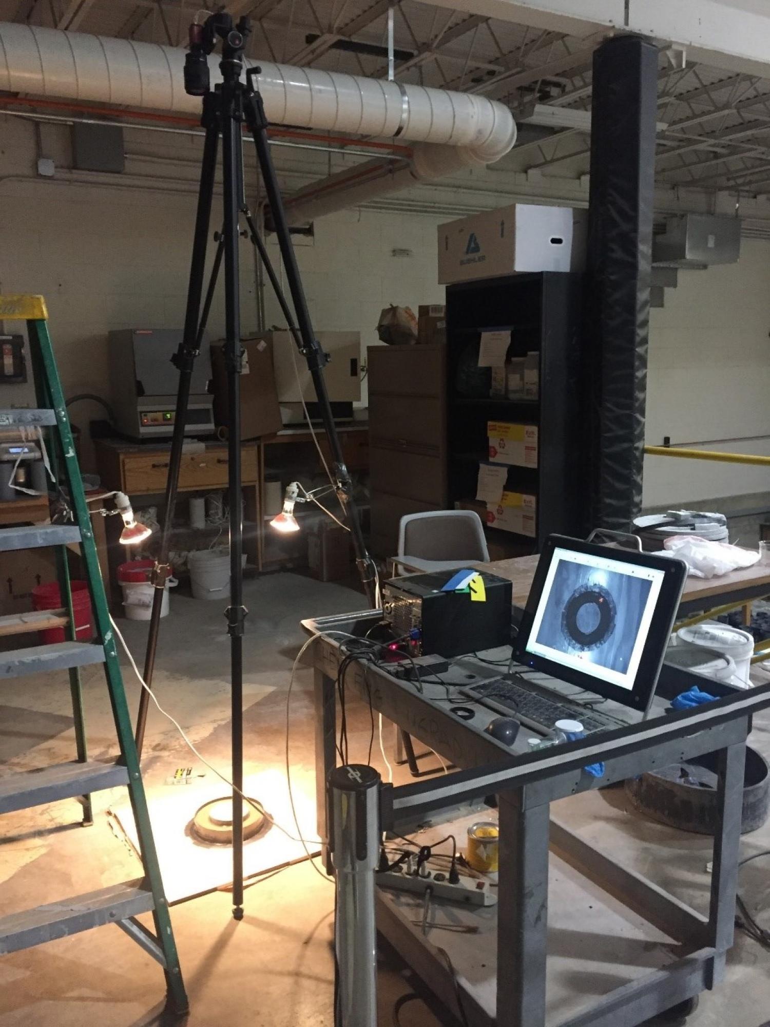 A computer in the foreground shows results of a test underway in the lab.