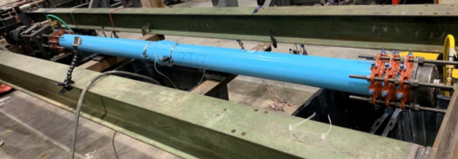 Denver water axial tension test specimen set up.
