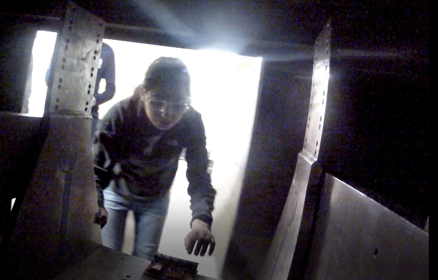 Camera image from inside centrifuge, looking out at Hiral Gandhi