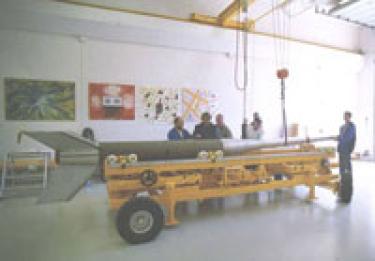 Attaching the payload to the rocket motor.