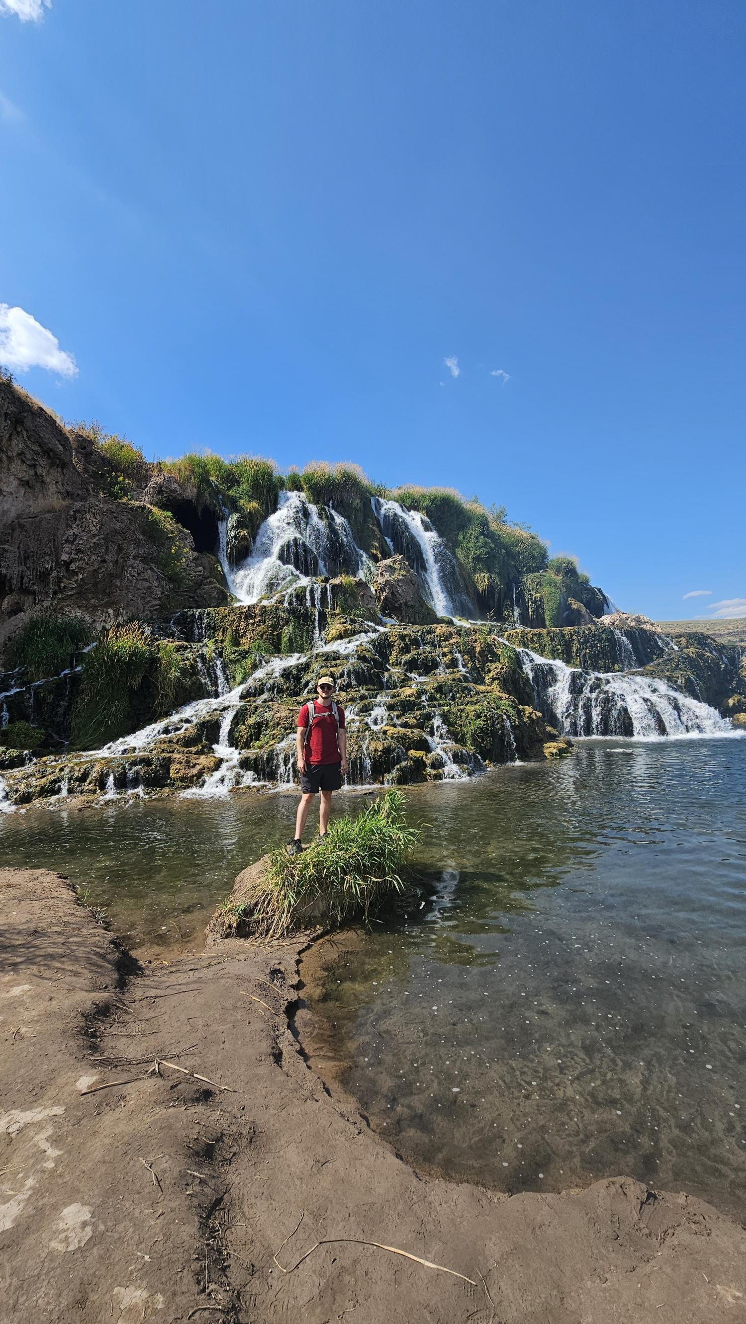 Ethan in front of a waterfall