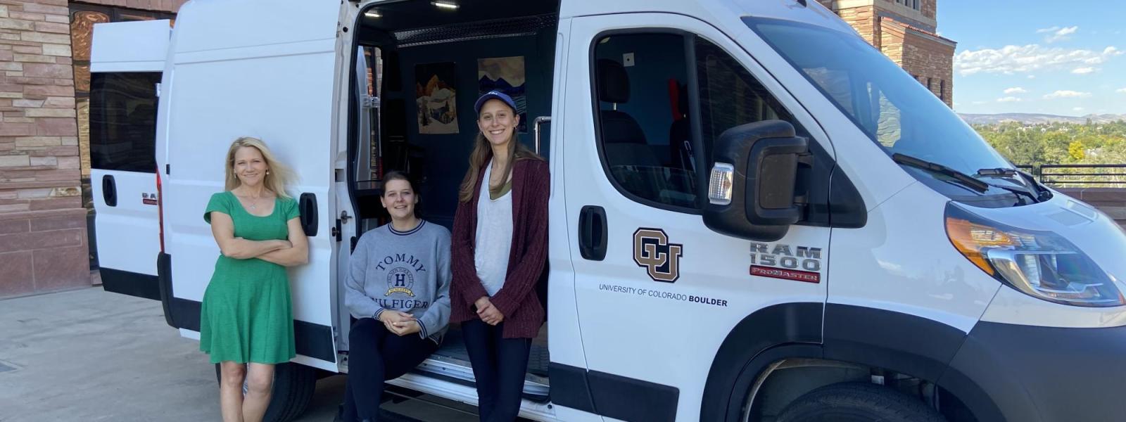Harmony, Maddie, and Angela in front of Van
