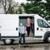 Kent Hutchison and Angela Bryan standing with mobile laboratory