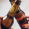 two bottles held by hands
